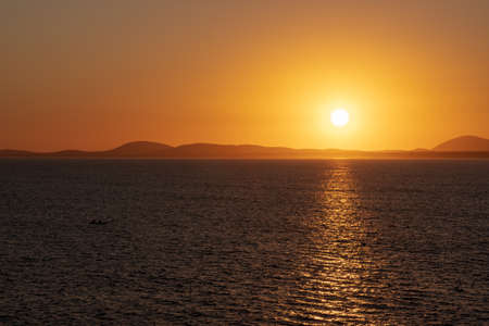 beautiful orange sky and sunset on the oceanic coast in Uruguay