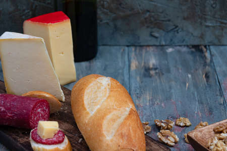 cheese platter with cold cuts and homemade bread to enjoy as a family with roasted almonds and...