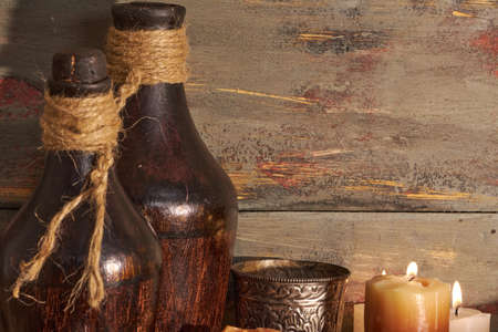 scented candles and other items on rustic wooden tableの写真素材