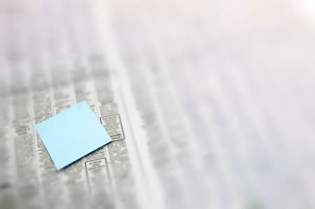 Post-It note in newspaperの写真素材