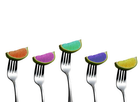 Colorful lemons on forksの写真素材