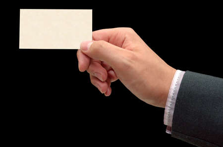 My business card - male hand holding a blank, textured business card - clipping path includedの写真素材