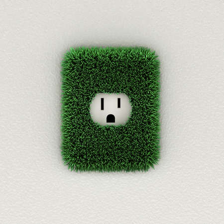 Environmental concept of an electrical outlet with grass leavesの写真素材