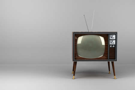 Classic vintage TV with wood veneer design in studioの写真素材