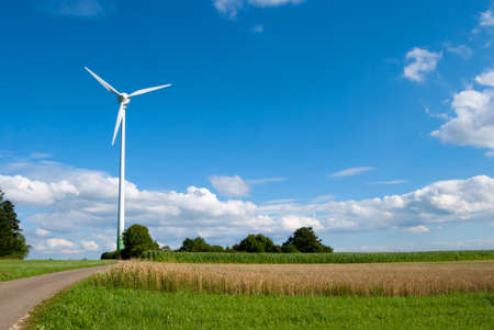 Wind power turbine in rural area on a sunny day.の写真素材