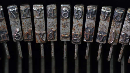 Super macro shot of rusted and dusty typebars of an old typewriterの写真素材