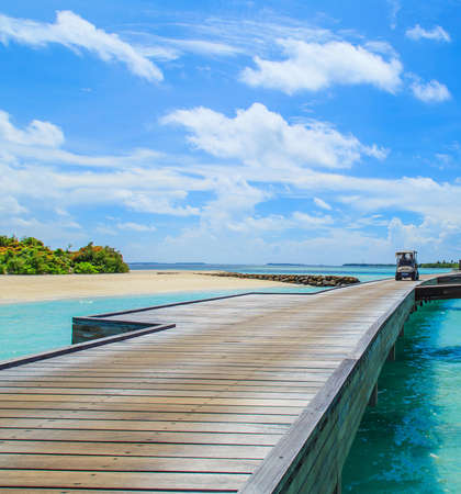 Blue sky with a shutter car across the bridgeの写真素材