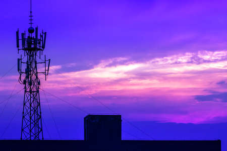 Communication tower with beautiful sunset as backgroundの写真素材