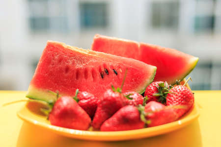 Ripe watermelon and strawberriesの写真素材
