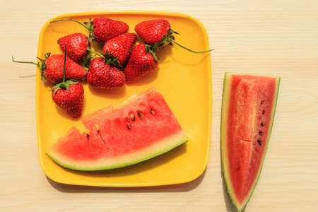 Ripe watermelon and strawberriesの写真素材