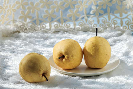 Fresh Pear on white fur clothの写真素材
