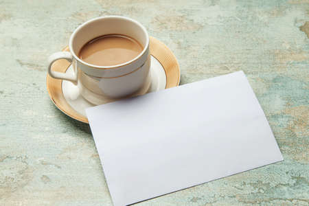 Coffee and paper on the tableの写真素材