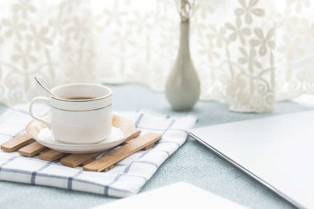 The laptop and other supplies on the table