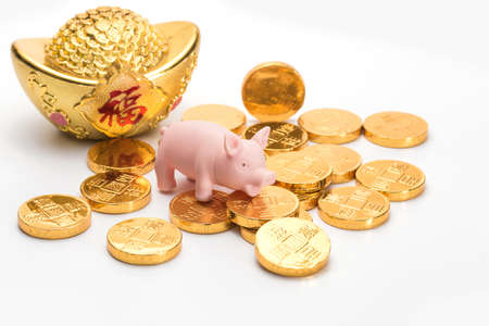 Gold ingot and gold coinsの写真素材