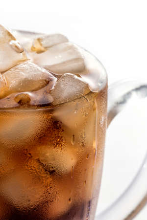 Glass of cola with ice cubes