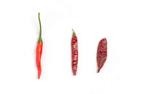 Red chili and dried chilies on white background