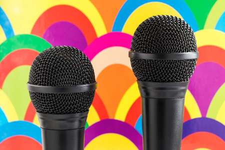 Microphones on colorful background