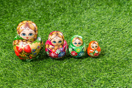 Russian dolls on green grassの写真素材