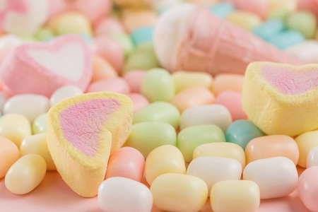 Colorful candies and heart-shaped marshmallows