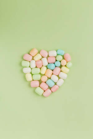 Colorful candy in heart-shapedの写真素材