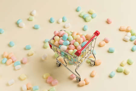 Colorful candies on shopping cartの写真素材