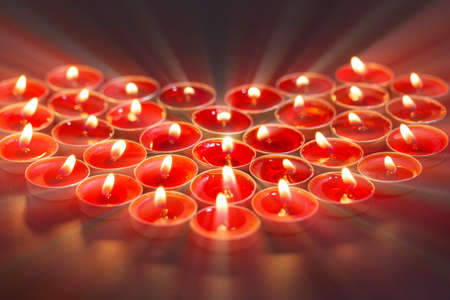 Burning heart-shaped candles