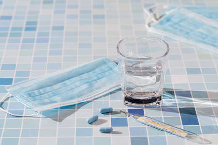 Disposable masks, thermometer and medicines