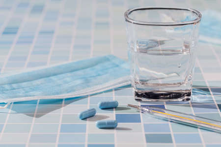 Disposable masks, thermometer and medicines