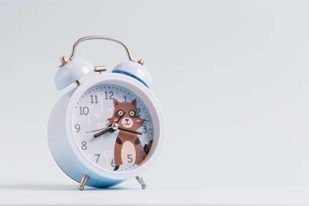 Alarm clock on blue backgroundの写真素材