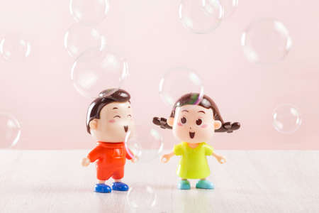 Two dolls with bubblesの写真素材