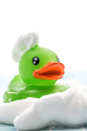 Toy duck taking a bathの写真素材