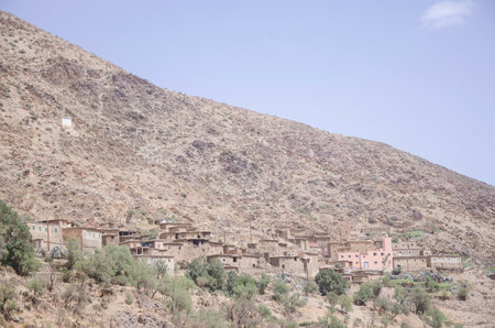 An ancient village, and castle on hills, in the Moroccan mountains, beautiful nature, large valleys, between rivers, historical ruins, sublime architecture built by natural means,の写真素材