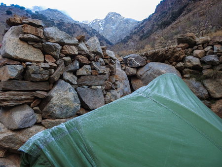 Camping tent winter in high atlas mountain, Frozen nature, ice and snow, cold landscape, beauty stream. deep mountains Morocco.の写真素材