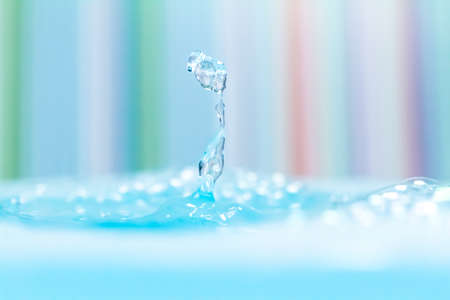 droplet fell into water on colorful backgroundの写真素材