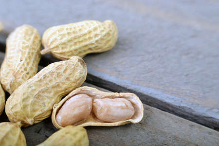 The Peanut On Wooden Background