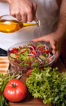 Man preparing saladの写真素材