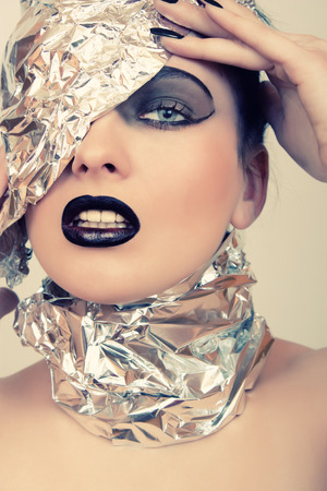 Futuristic portrait of a woman with dark makeupの写真素材