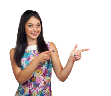 Isolated young woman is presenting or pointing with her finger.の写真素材