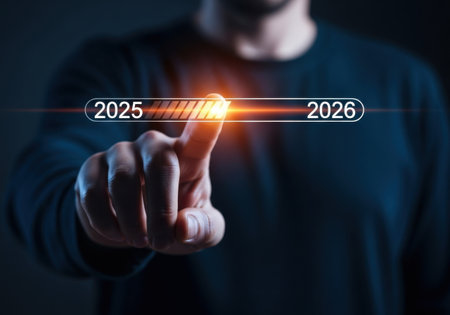 a man is pushing a progress bar from the year 2025 to 2026 showing advancement and future successの素材