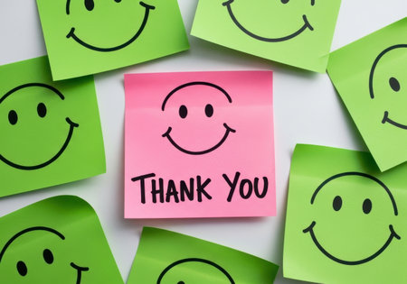 a thank you note with smiley faces expresses gratitude and appreciation in a positive way.の素材