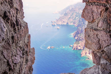 View from a ancient tower on the top of a very high mountain, overseeing the coast of Corsicaの写真素材