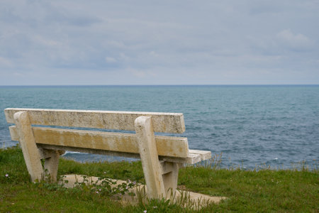 Bench overlooking the seaの写真素材