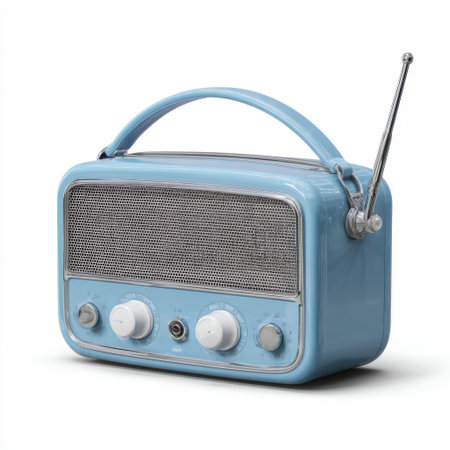 A light blue vintage-style portable radio with a silver speaker grille, two white knobs, and a silver antenna, set against a white background.の素材