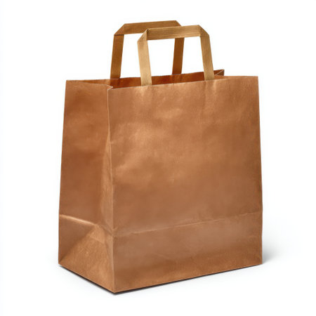 A plain brown paper bag with two sturdy handles, isolated on a white background. Ideal for shopping or packaging.の素材