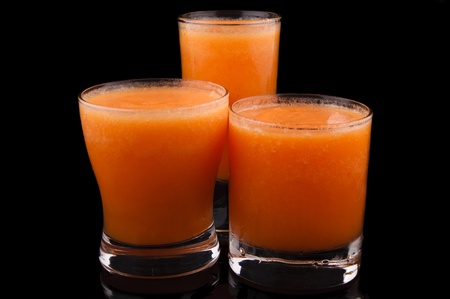 Glasses of organic juices isolated on the blackの写真素材