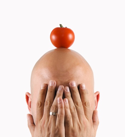 Tomatoe on my headの写真素材