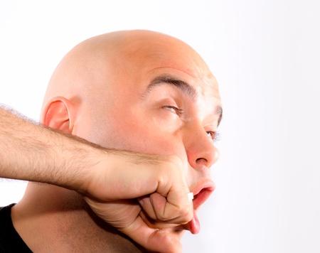 Bald guy recive a punchの写真素材