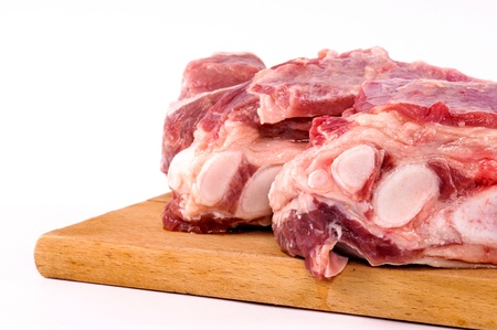 Fresh raw meat on wooden board の写真素材