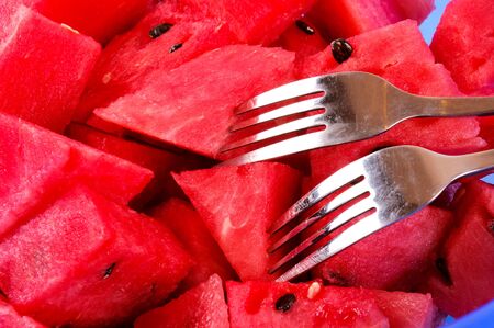 Watermelons slices with the spoonsの写真素材