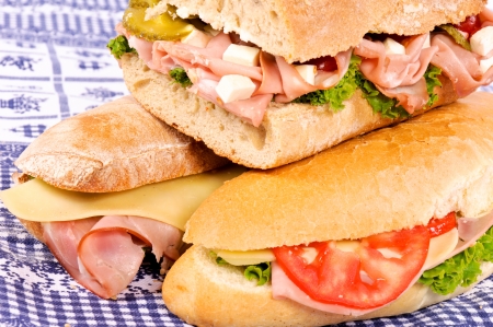 Three yummy sandwich on the tableの写真素材